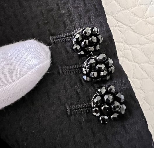 Black double-breasted suit with jewel buttons